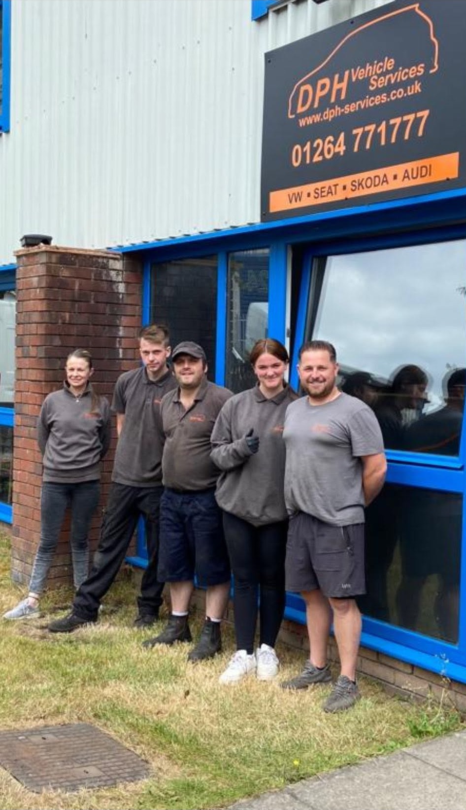 The DPH team outside the unit in Weyhill, under the DPH Vehicle Services sign