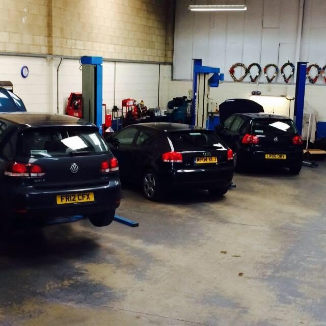 VW and Audi cars on the lifts inside the DPH workshop